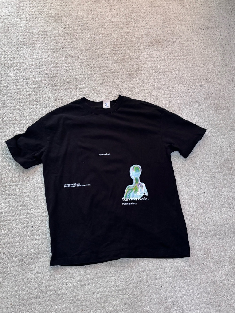 Black Short-Sleeve Graphic Tee with Abstract Color Figure